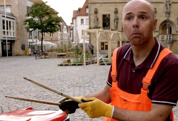 Watch Karl Pilkington play the bins in priceless street performance